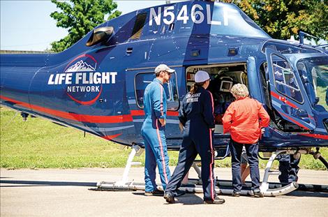  Life Flight  Network crew  members show  people the inside  of the emergency  transport helicopter. 