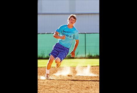 Tyson Petticrew races around second during the relay around bases event. Petticrew and his teammates won the event.