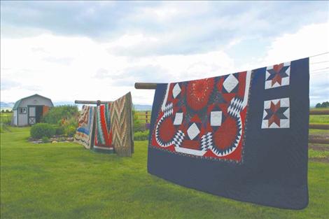 Handmade quilts sent from Amish communities all over the country are displayed at the Amish consignment auction in St. Ignatius.