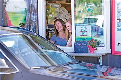 Tanya Patrick and Tasha Avison greet a customer at their Small Town Girl Coffee business north of Polson.