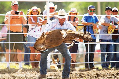 Colt Stonehocker of Charlo flips his steer during the tie down event.