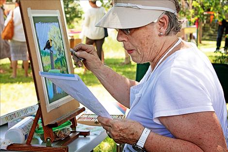 Juanita Small Salmon works on a pastel painting. The painting will be donated to the Ninepipes Museum to be auctioned off during a fundraiser at a later date.