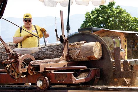 Larry Eslich operates the museum’s sawmill during the annual Live History Days event.