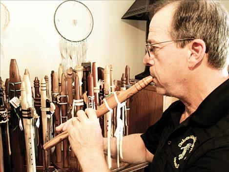 Webb plays one of his hand-made flutes.