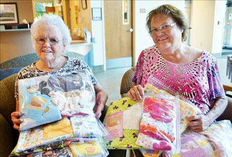 Seventh Day Adventist Church members Ruth Horton and Beth Krein drop off layettes to St. Luke’s New Beginning Birth Center.
