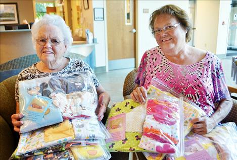 Seventh Day Adventist Church members Ruth Horton and Beth Krein drop off layettes to St. Luke’s New Beginning Birth Center.