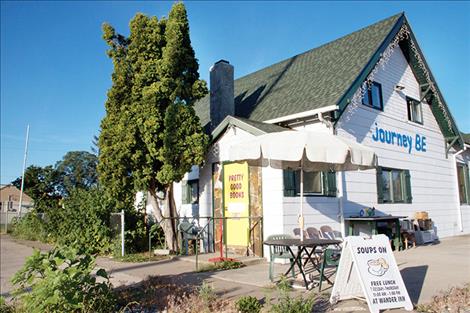 Pretty Good Books is located behind the yellow door of JourneyBe. 