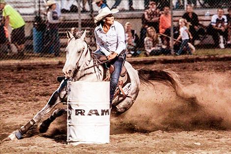 A woman competes in the 2016 Flathead River Rodeo barrel races.
