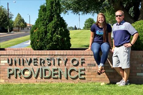 Jenna Evertz poses with Lady Argos soccer head coach Brian Clarke.