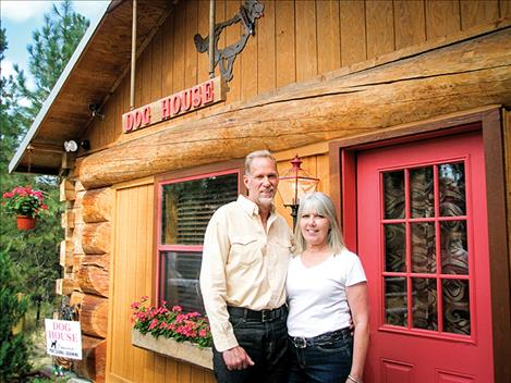 Beverly Weimar and her partner Gerry Albus stand in front of the Dog House whcih opened in June.