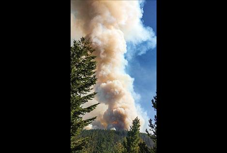 Posted on the Division of Fire’s Facebook page on July 26, the photo shows a plume of smoke from the Liberty fire which, as of Monday morning, has burned more than 1,800 acres of Mission Mountain tribal wildnerness.
