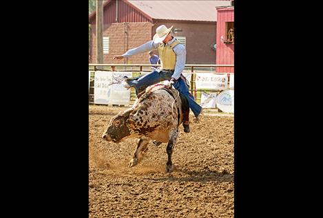 Payton  Fitzpatrick takes his turn on the back of a bull at this year’s Ronan Pioneer Days Rodeo.
