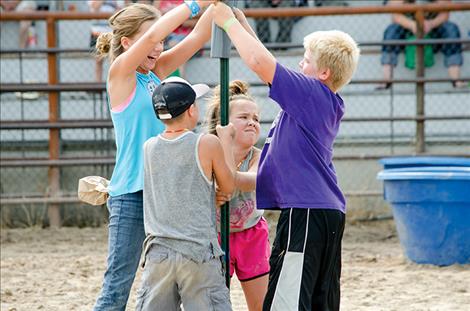 During the Farmer Olympics kids used a post driver to pound a post a few inches into the ground.