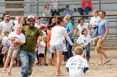 Karen Peterson/Valley Journal photos Kids brought a family member into the area to participate in the Kid Scramble.