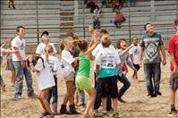 Kids, animals scramble around arena during city slicker rodeo
