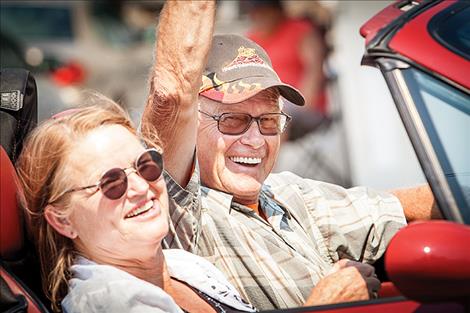 Sandra and Gary Noland are all smiles driving in Ronan’s parade. 