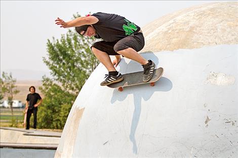 Jesse Robertson wall riding the side of the helmet.