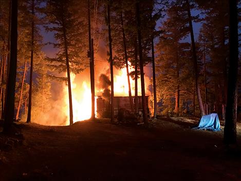 A home on Finley Point was lost to fire on the evening of Wednesday, Aug. 9. This photo was taken at 9:18 p.m.