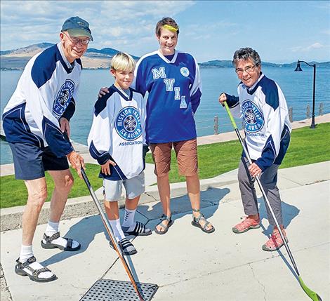 Left to right: GPCF’s Roger Smith, future hockey player Koda King, MVIAA Chair Hilary Lozar, and Libby Smith sport MVIAA hockey jerseys and look forward to ice sports at the future Mission Valley Ice Arena. 