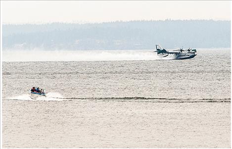 Scooper planes as well as five helicopters are being used in supression efforts. Scooper planes fly at a high speed just above the surface of the water, scooping a large amount of water into the belly of the plane to drop over a fire.