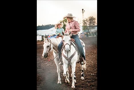 Young barrel racer Kesler Harwood beams at her mother Bess.