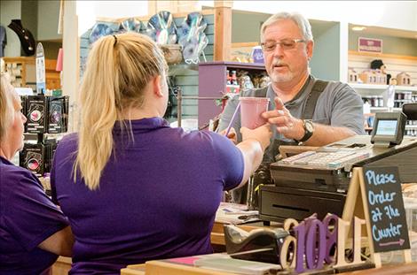 Sarah Schurg serves a customer a huckleberry milkshake for breakfast.  