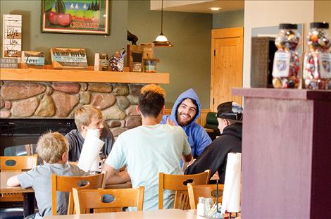 The Arlee football team and family members eat breakfast before  a game.