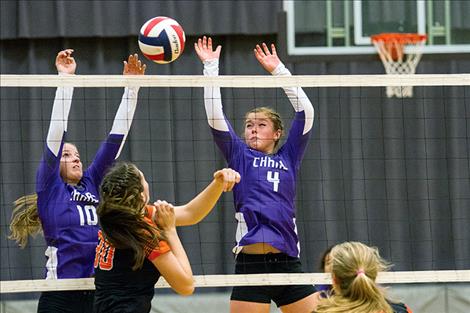 Lady Vikings’  Allie Delaney  and Brooklyn Foust  battle at the  net during Charlo’s  homecoming game  against the Lady  Trotters Saturday.