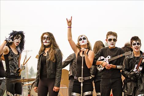 The Charlo eighth-graders rock out on their float “KISS the warriors goodbye” during Charlo’s homecoming parade on Friday. 