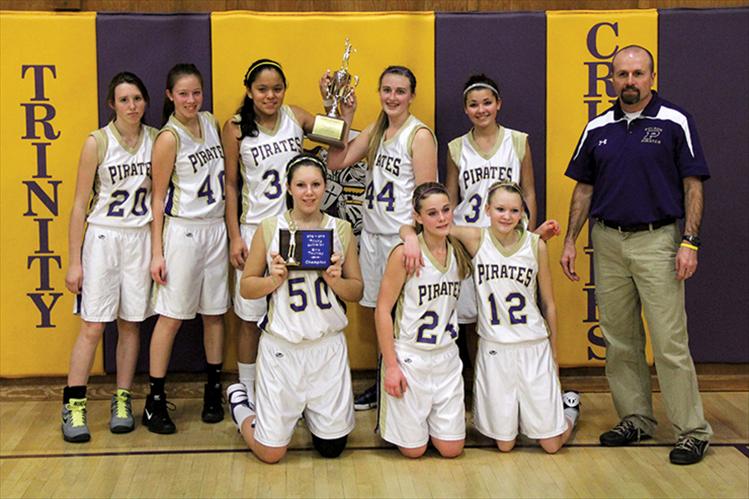 The Polson Lady Pirate eighth-grade basketball team shows off their first-place trophies after winning the end-of-the-season Trinity Tournament in Kalispell. Athletes are (back row left to right) Cheyanne Morrison, Hannah Fryberger, Lee Camel, Emma Shew and Cassie Carlyle; front, Mollie Fisher, Izabella Seeman and Chadelle Smith, along with coach Joe Quinn. Not pictured are managers Montana Morigeau and Malia Vandeburg.