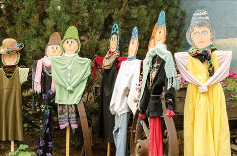 Scarecrows, built by a team of community members, will be sold at this weekend’s Harvest Fest to help offset the cost of watering the flowers that grace Main Street in Ronan.