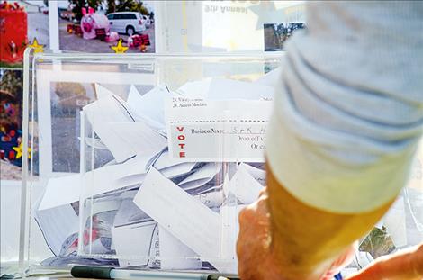 The voting box for the hay bale contest fills up quickly.