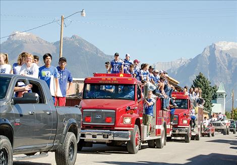 Mission students circle the town during the homecoming parade on Friday.