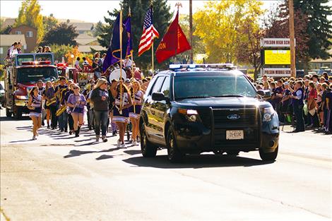 The homecoming  parade went through town  to celebrate school alumni. 