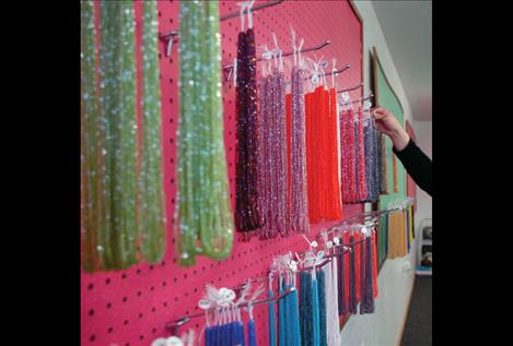 Hanks of tri-cut beads sparkle on the pegboard in Northern Creations, Dacia Whitworth’s new beading supply shop in Ronan. 