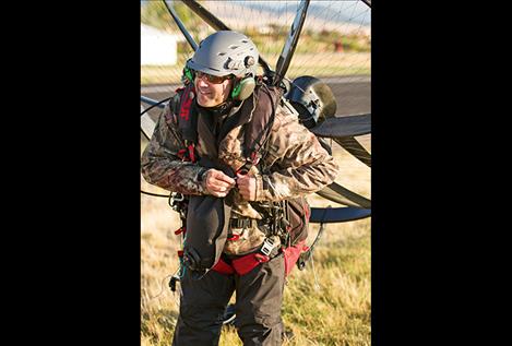 Icarus  pilot  Jack  Nordberg straps on the motor.