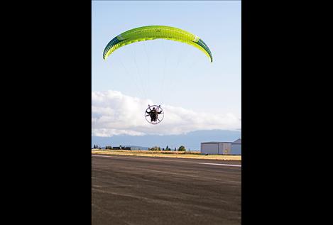 An aviator takes off from the Polson Airport.