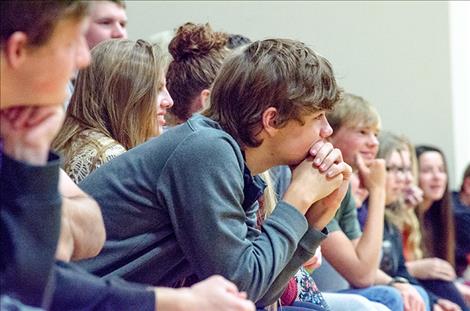 Charlo  students listen to speakers during an assembly.