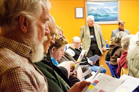 Members of the public and community leaders listen to speakers during a Mission Valley Rises: Democracy Engaged! meeting on Tuesday to discuss  the state’s budget shortfall and what cuts could mean for local groups.