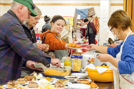 Voluteers serve lunch to support the Brown Building. 