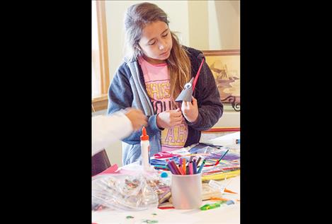 Carla Morigeau, 10, makes a turkey craft project hosted by a new group called Arlee Youth Connection.