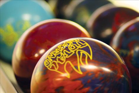 Colorful bowling balls await bowlers during league play last week.