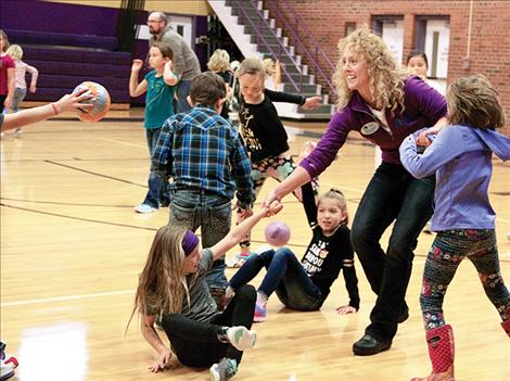 Shauna Rubel of Glacier Bank plays a game of dodgeball at Linderman during a school event held to recognize third grade Students in Good  Standing.