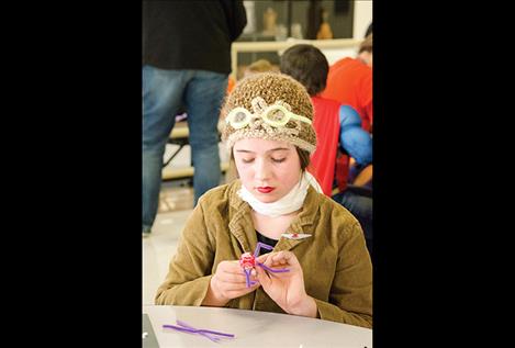 Amelia Cronk works on a craft.