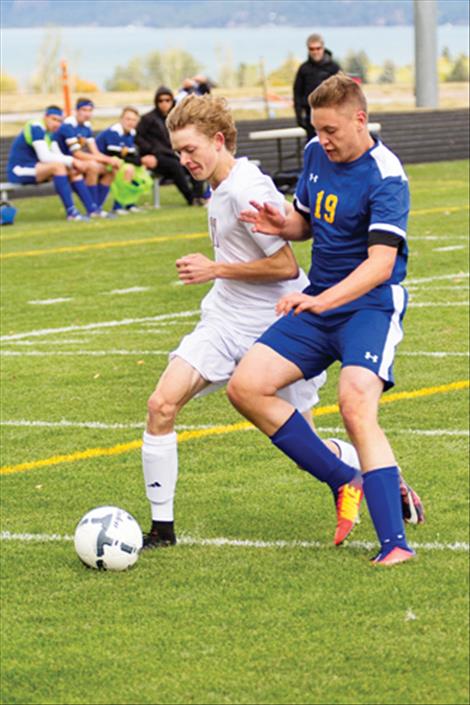 Pirate Robin Erickson battles defender for the ball.