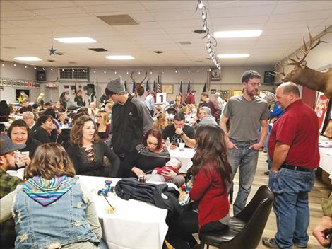 The community gathers to support the Cross family at a recent fundraising spaghetti dinner in Polson.