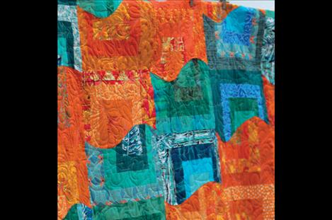 Teal and tangerine describe this Carl Rohr quilt's vivid colors.