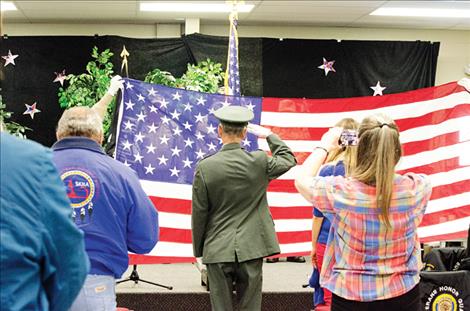 Ronan VFW Post 5652 salutes the colors during the opening ceremony.