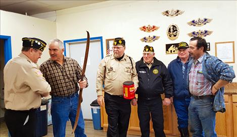 Custom bow creator Dan Toelke congratulates Tom Leafty, winner of the Veterans Day raffle drawing. Pictured left to right are: Tom Leafty, Dan Toelke, Glen Sharbono, Ed Cornelius, Garry Hoffer and Kim Aipperspach.