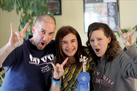 Mike, Suzanah and Bonnie Clark show their enthusiasm at Suzanah winning the county spelling bee..